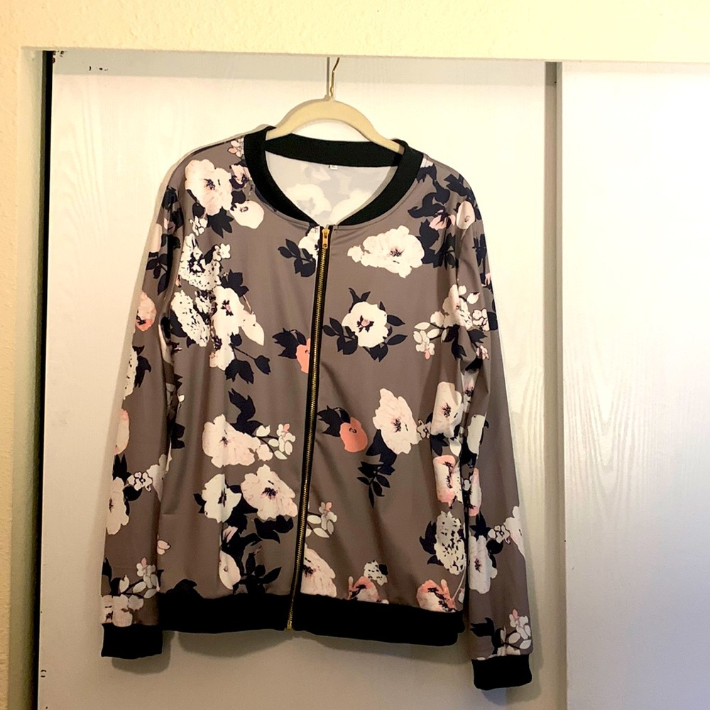 Cute floral bomber jacket. Zip up silky material , very gently worn